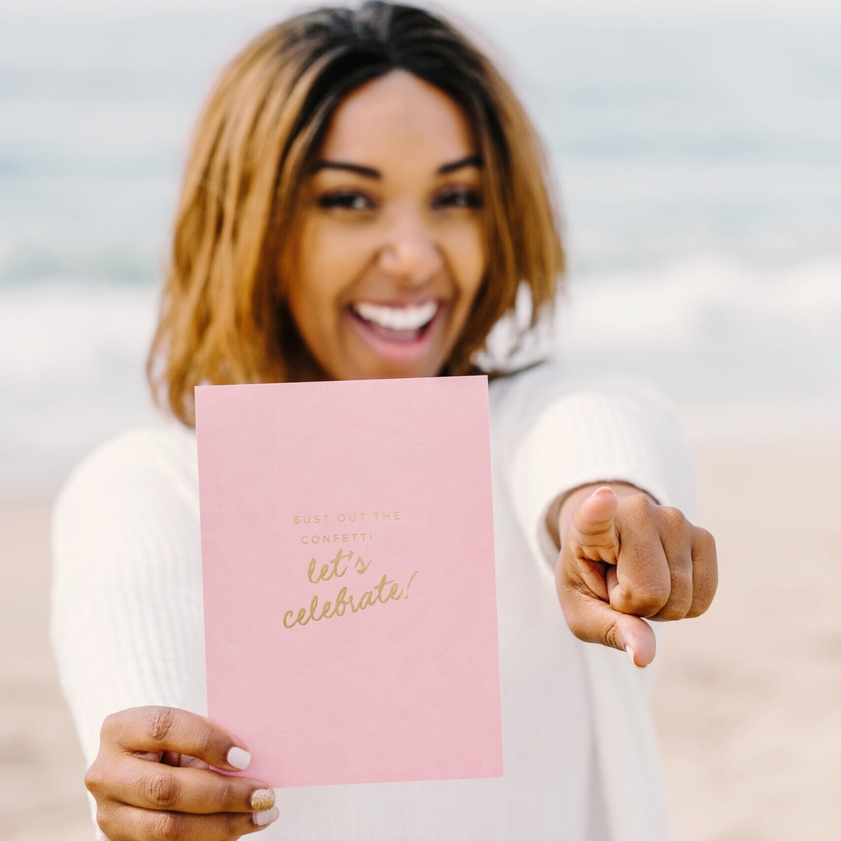 Woman celebrating on beach